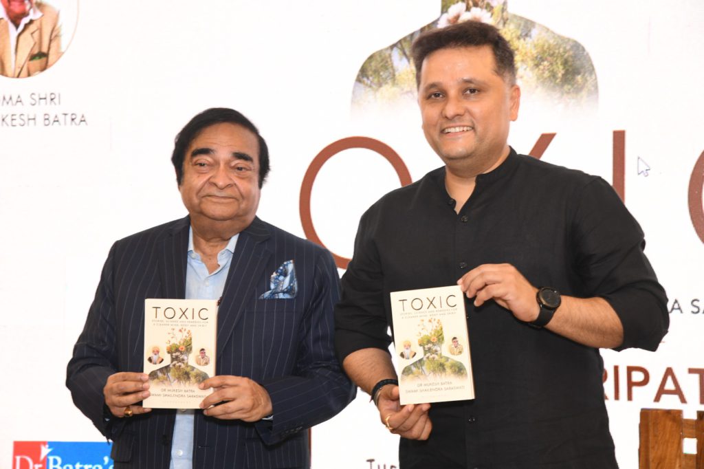 Dr Mukesh Batra and Amish Tripathi holding Toxic book